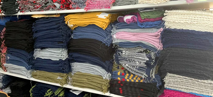 Coloured wool knits awaiting finishing at KAMA